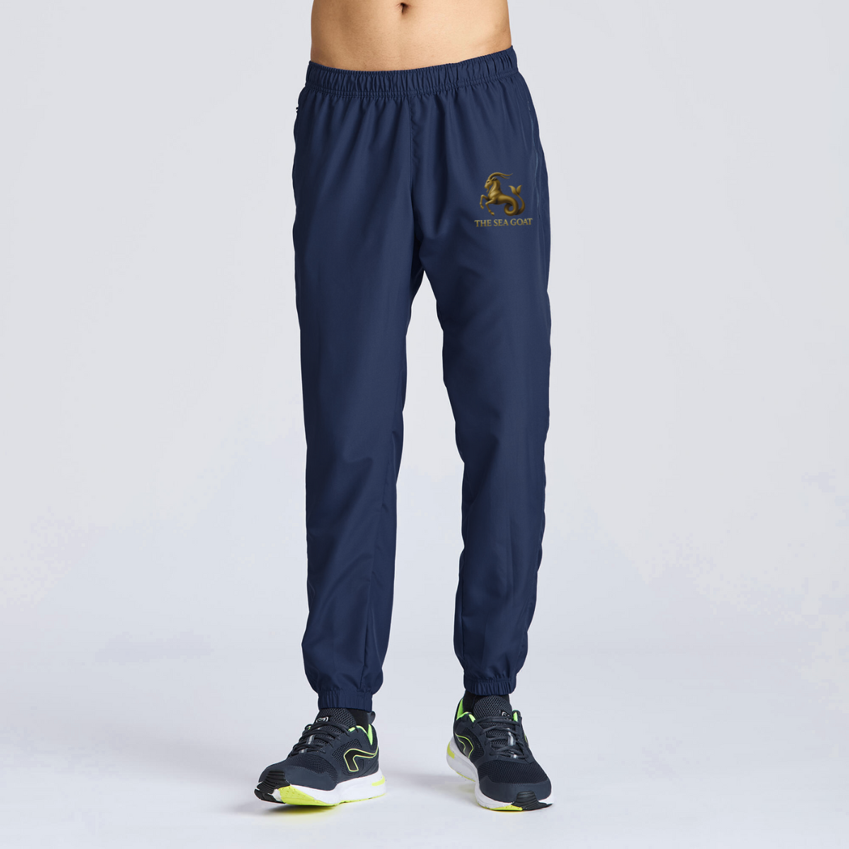 Navy blue jogger pants with a logo on a light gray background
